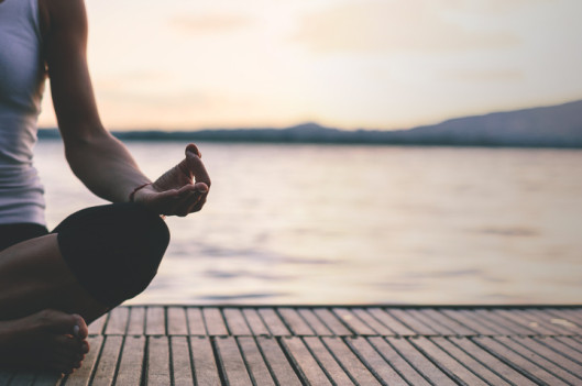 Woman Meditating on a Dock | How (and Why) I Meditate