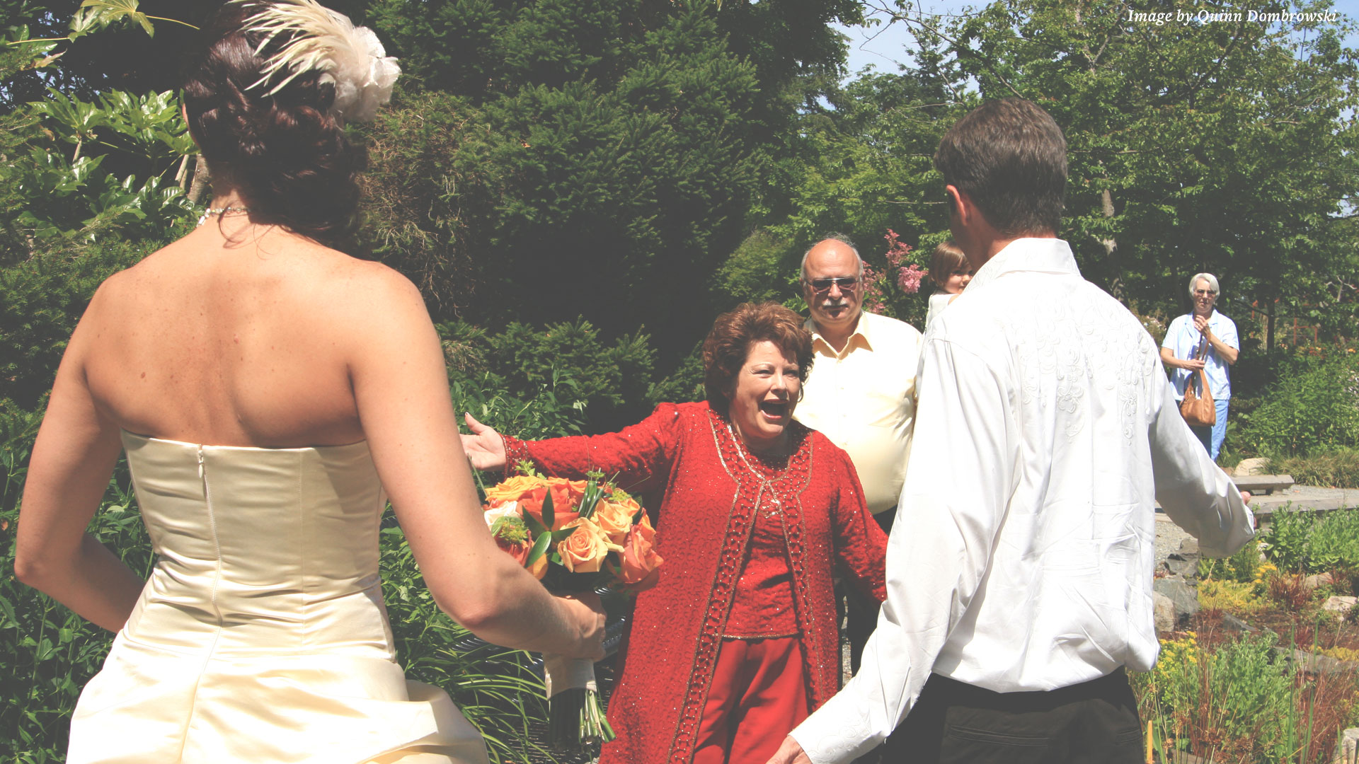 mother in law greeting son at wedding
